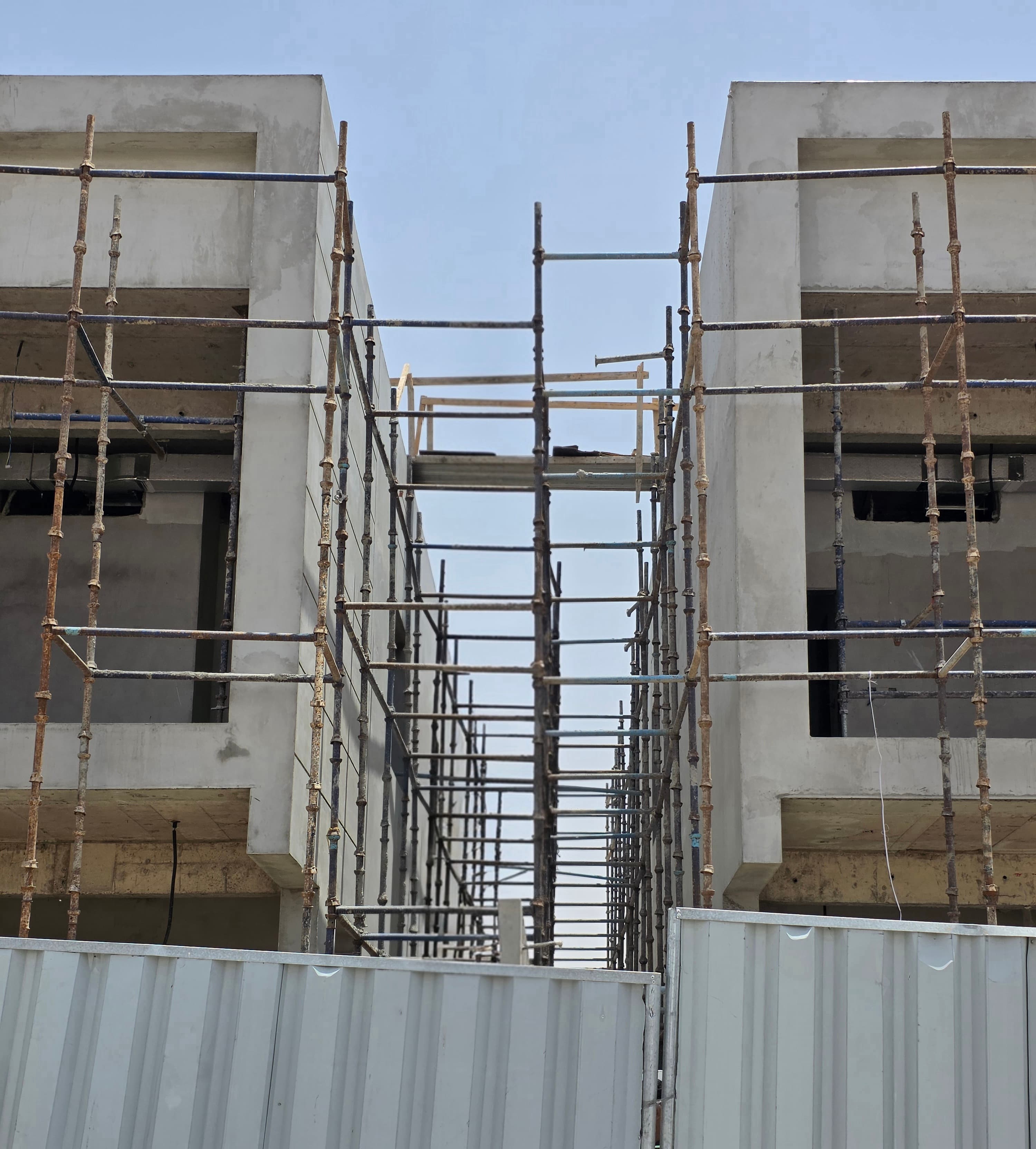 Scaffolding erected on a building for exterior plastering work in Dubai